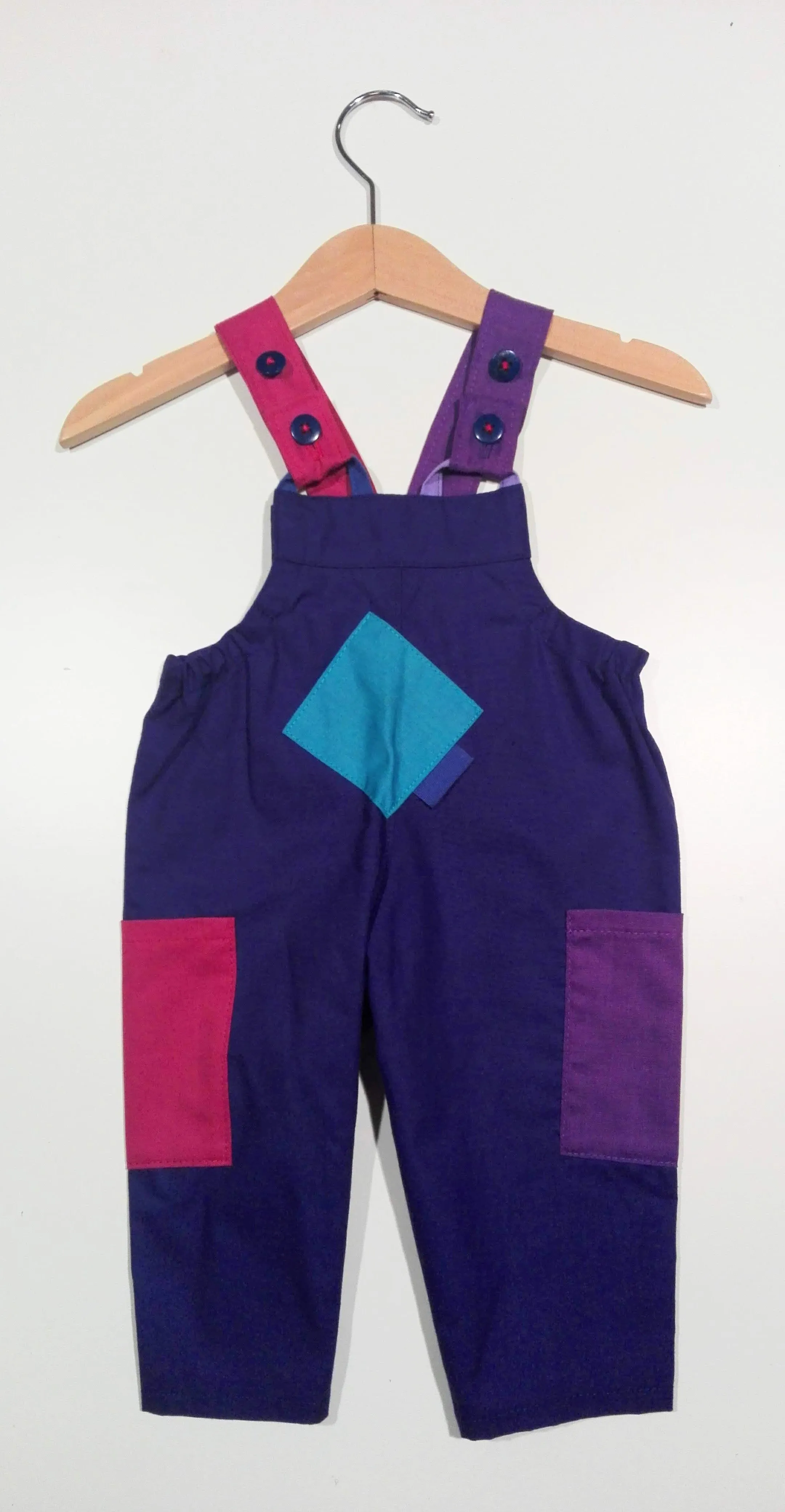 Dungaree in cotton with colored patches